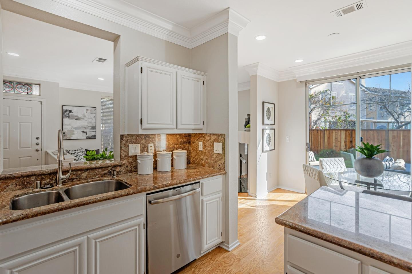 298 Gemstone Way Milpitas, CA 95035 - Photo 14 of 41 a kitchen with kitchen island a sink appliances and cabinets