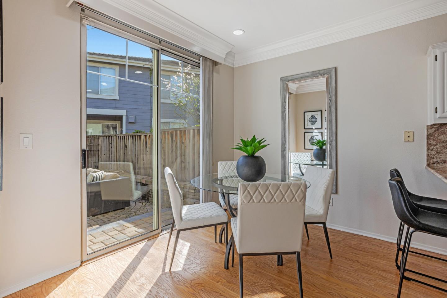 298 Gemstone Way Milpitas, CA 95035 - Photo 16 of 41 a view of a dining room with furniture and wooden floor