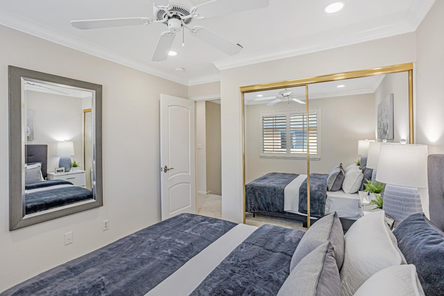 298 Gemstone Way Milpitas, CA 95035 - Photo 22 of 41 a bedroom with a bed and a chandelier