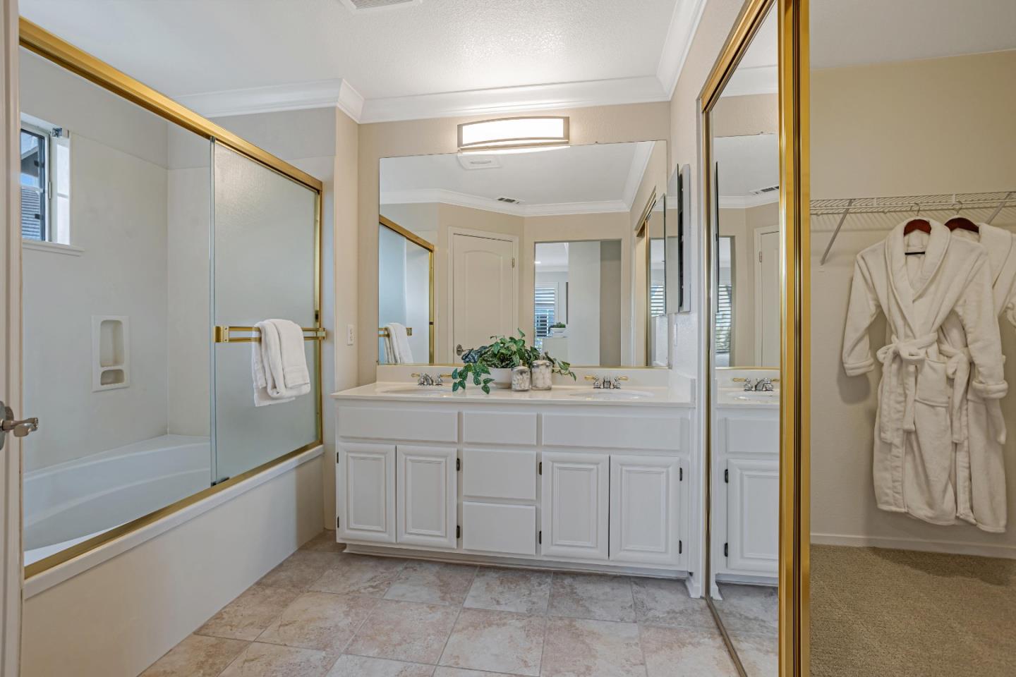 298 Gemstone Way Milpitas, CA 95035 - Photo 32 of 41 a spacious bathroom with a granite countertop sink a mirror a shower and a bathtub