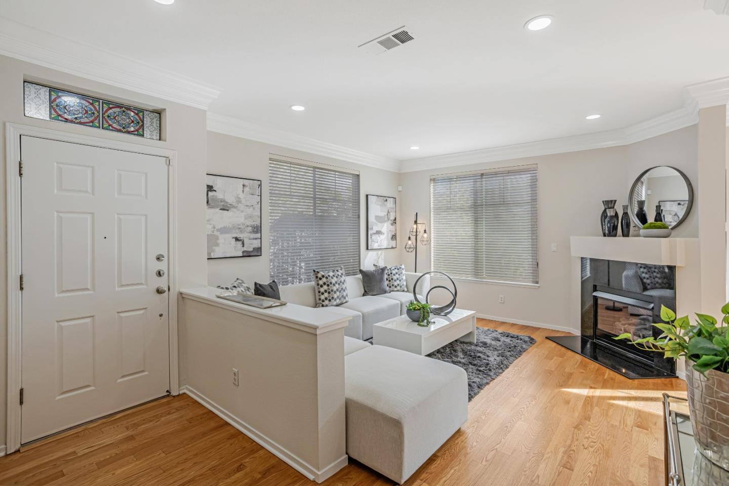 298 Gemstone Way Milpitas, CA 95035 - Photo 6 of 41 a living room with furniture a fireplace and wooden floor