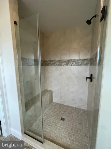 a view of an empty room with stairs