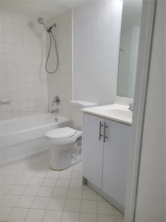 a bathroom with a toilet sink and shower