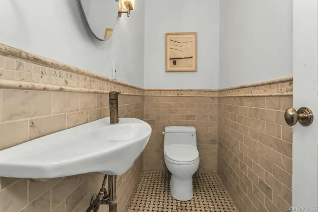 a bathroom with a toilet a sink and a shower