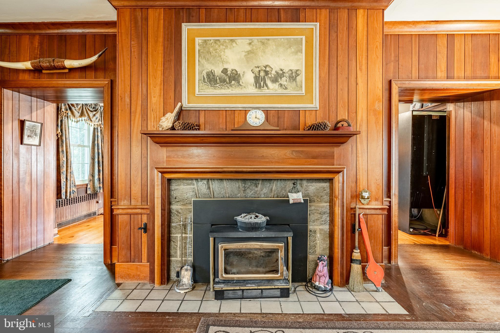 245 Rosedale Drive Pottstown, PA 19464 - Photo 11 of 57 a living room with a fireplace wooden floor and a window