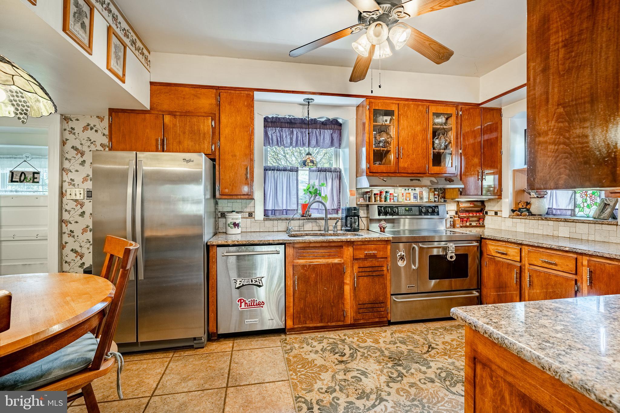 245 Rosedale Drive Pottstown, PA 19464 - Photo 21 of 57 a kitchen with stainless steel appliances granite countertop a stove refrigerator and cabinets