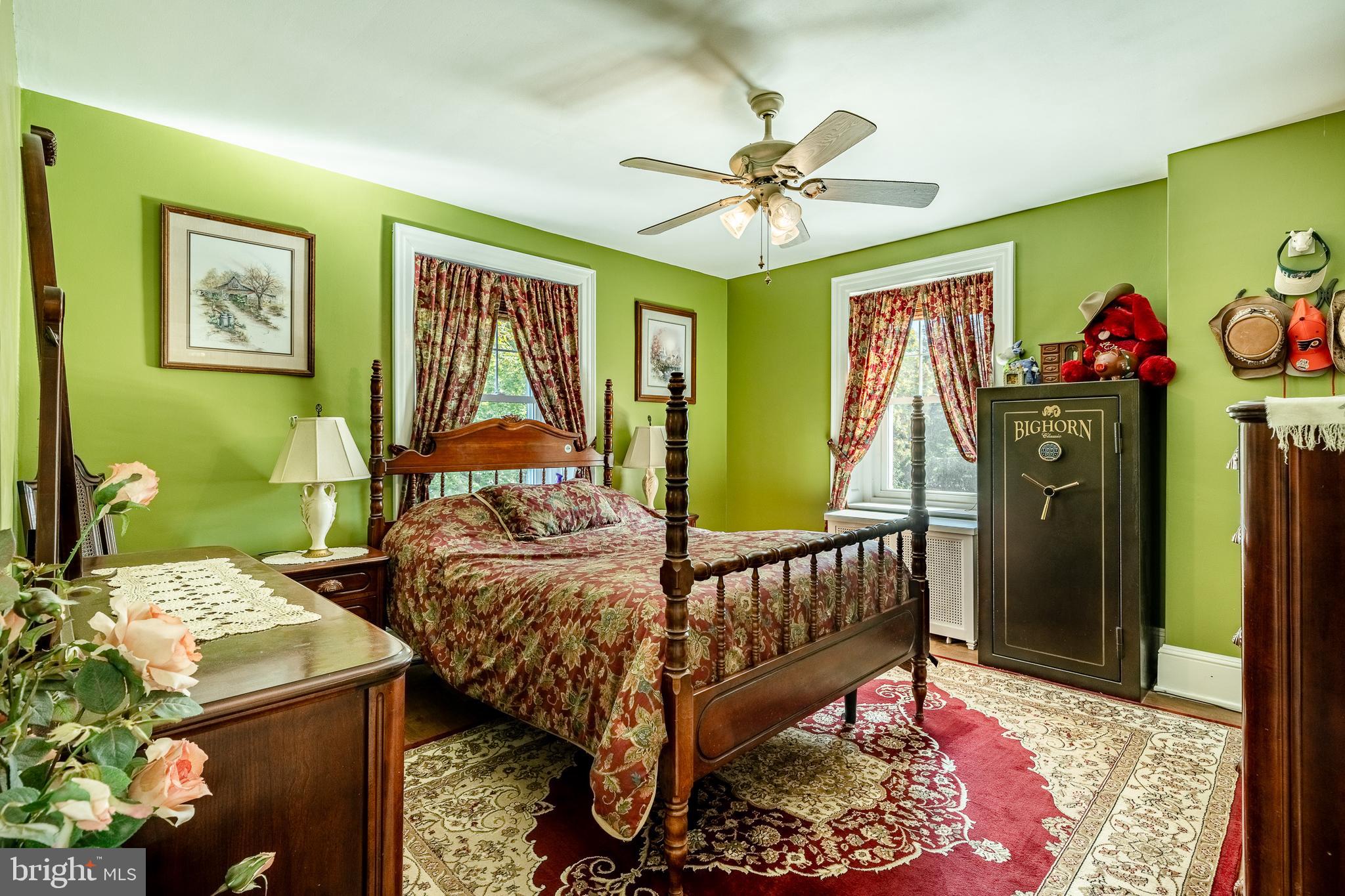 245 Rosedale Drive Pottstown, PA 19464 - Photo 26 of 57 a bedroom with a bed a dresser and potted plants