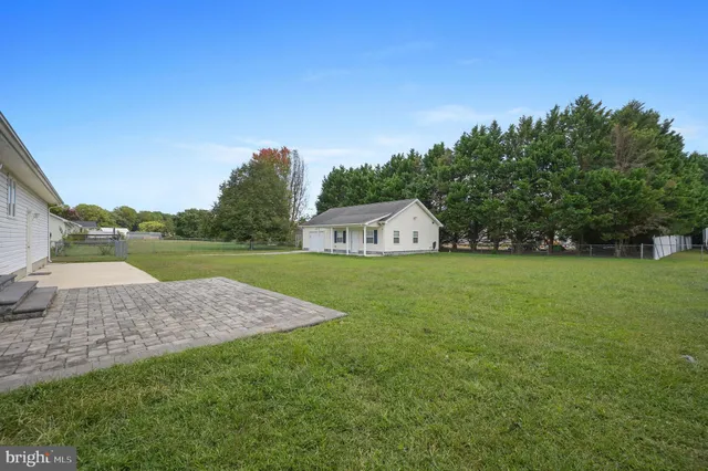 a view of outdoor space with garden and trees