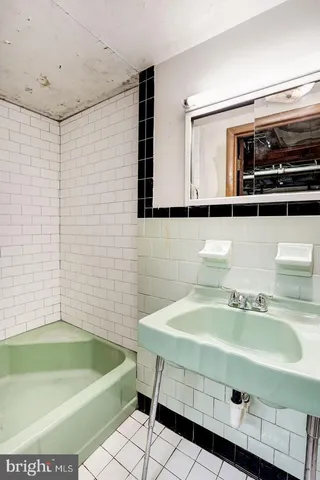 a bathroom with a sink and a bathtub