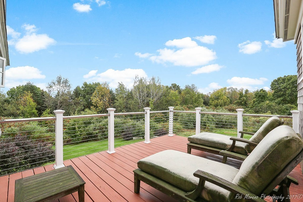 10 Hovey's Pond Boxford, MA 01921 - Photo 25 of 30 a view of a balcony with wooden floor and outdoor seating