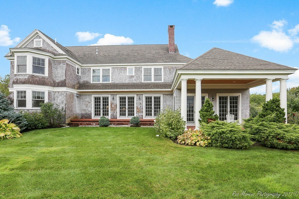 10 Hovey's Pond Boxford, MA 01921 - Photo 27 of 30 a front view of a house with a garden