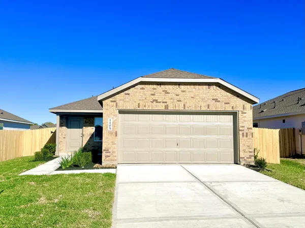a view of a house with a wooden fence