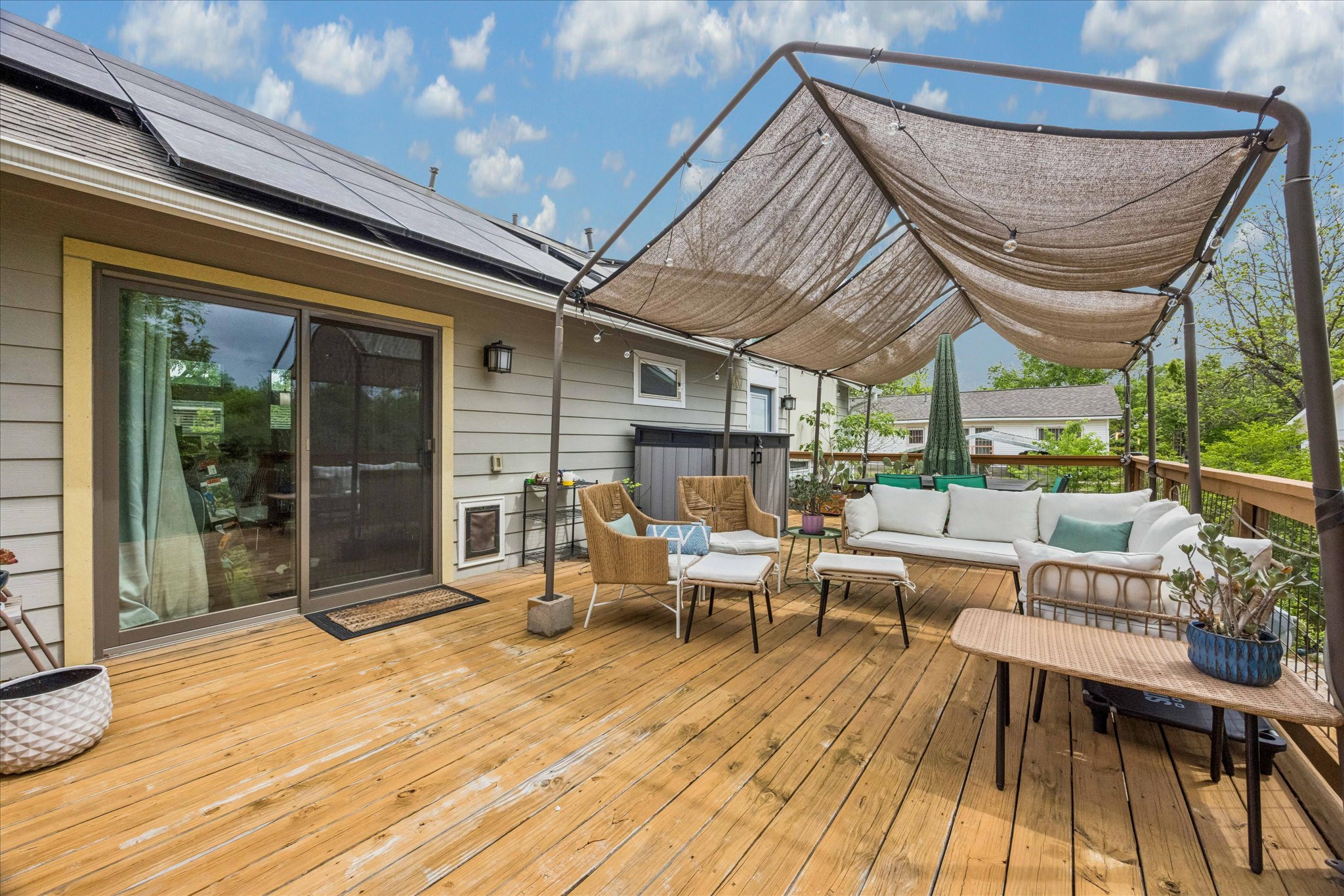 1800 Deloney Street Austin, TX 78721 - Photo 17 of 25 a view of a patio with table and chairs potted plants with wooden floor and fence