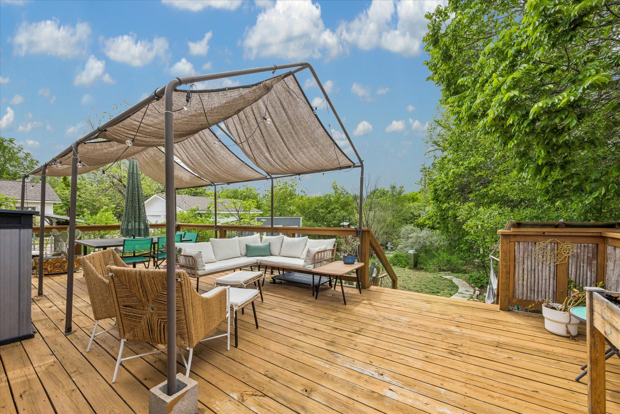 1800 Deloney Street Austin, TX 78721 - Photo 19 of 25 a view of a patio with table and chairs under an umbrella with wooden floor