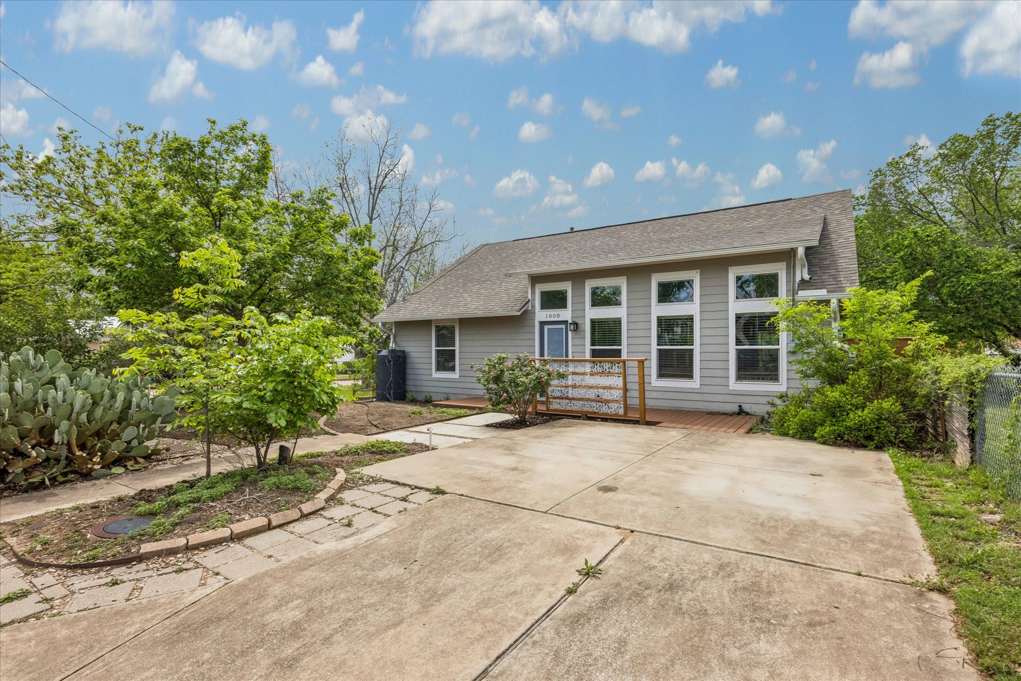1800 Deloney Street Austin, TX 78721 - Photo 2 of 25 a view of a house with a patio and a yard
