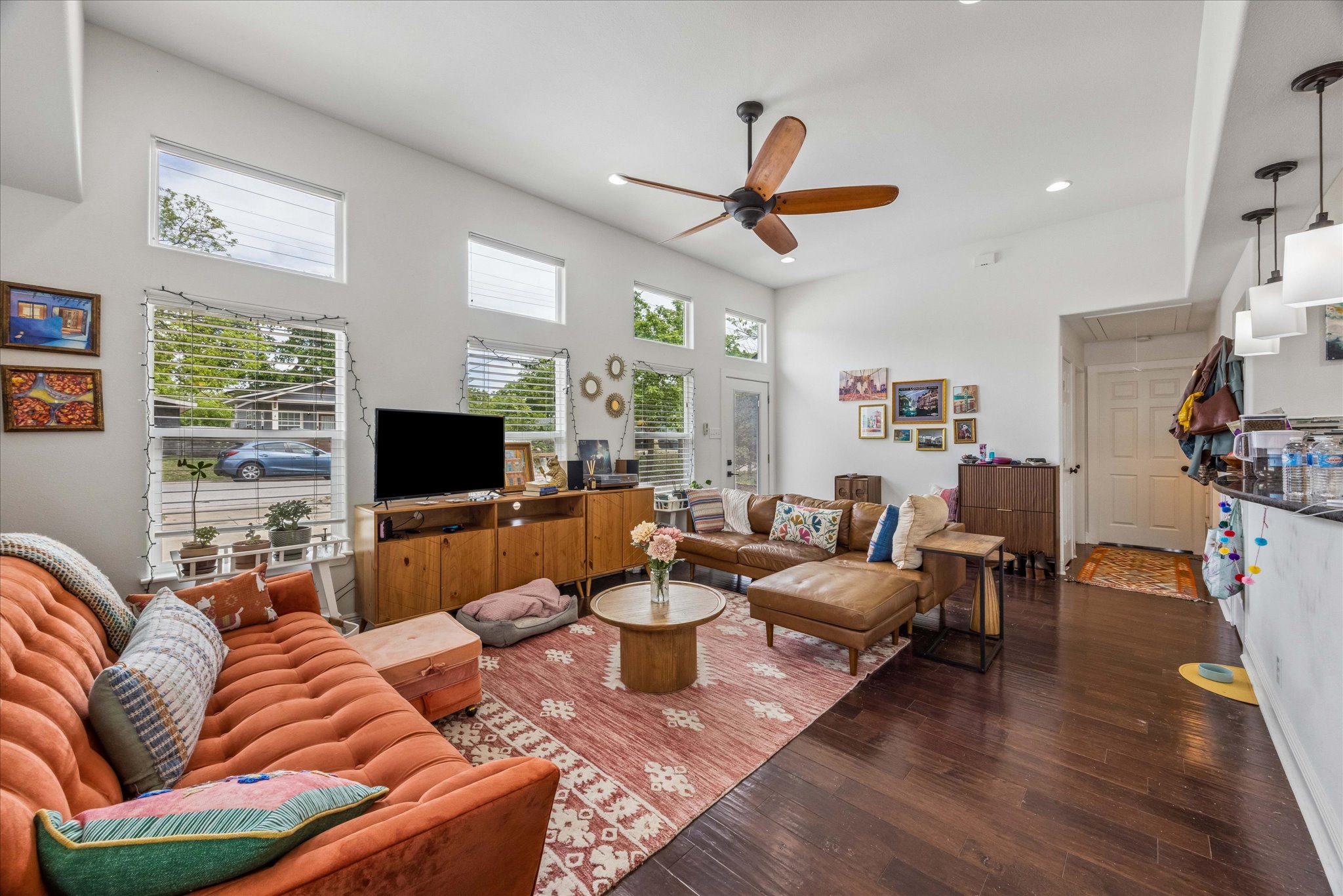 1800 Deloney Street Austin, TX 78721 - Photo 4 of 25 a living room with furniture a flat screen tv and a fireplace