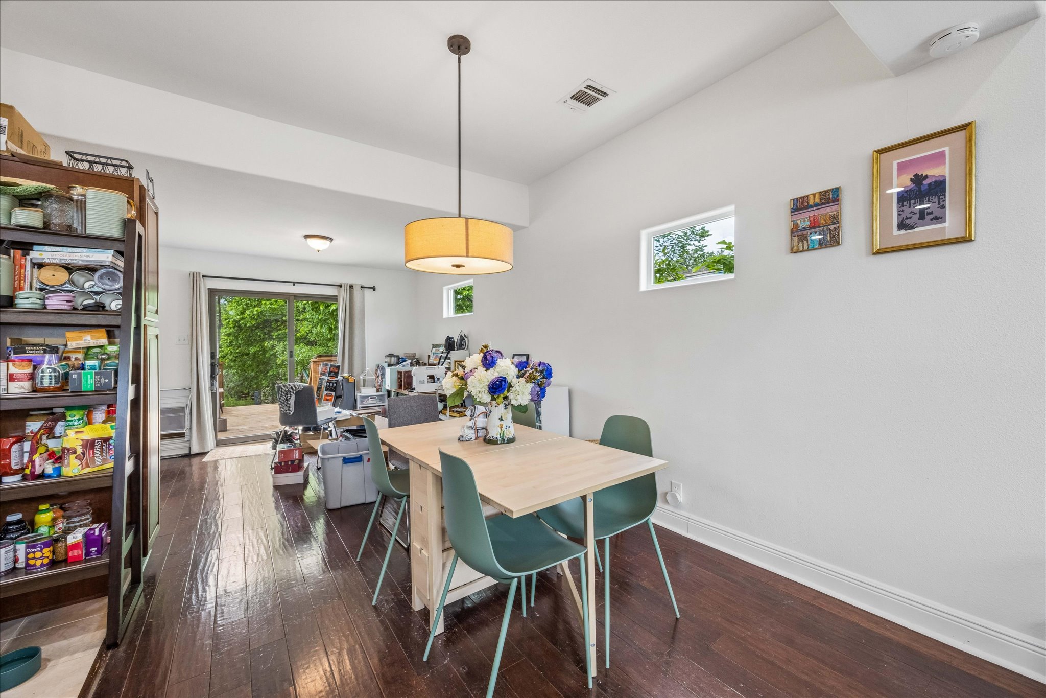 1800 Deloney Street Austin, TX 78721 - Photo 9 of 25 a view of a dining room with furniture window and wooden floor