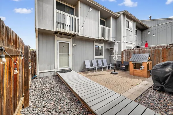 a backyard of a house with seating space