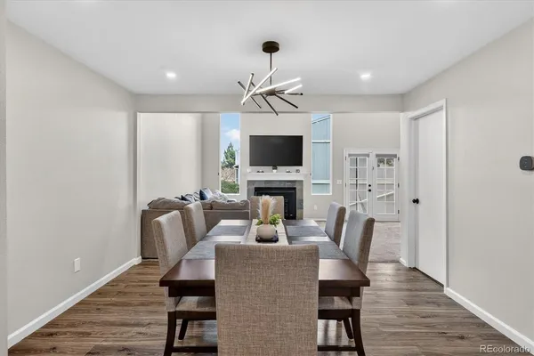 a view of a dining room with furniture window and wooden floor
