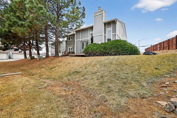 a front view of a house with a yard and a garage