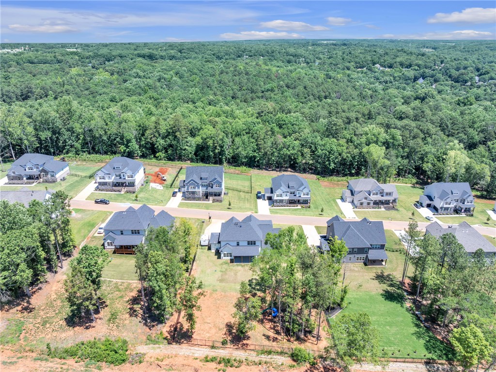 226 Holly Br Road Piedmont, SC 29673 - Photo 40 of 44 An aerial perspective reveals a new neighborhood nestled among verdant woodland, offering tranquil suburban living.