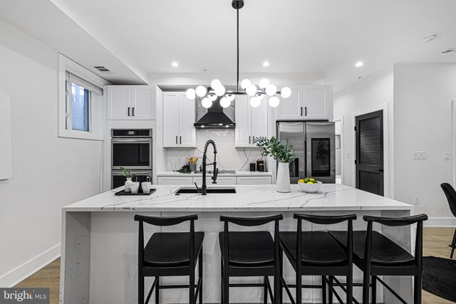 a view of a dining room and kitchen