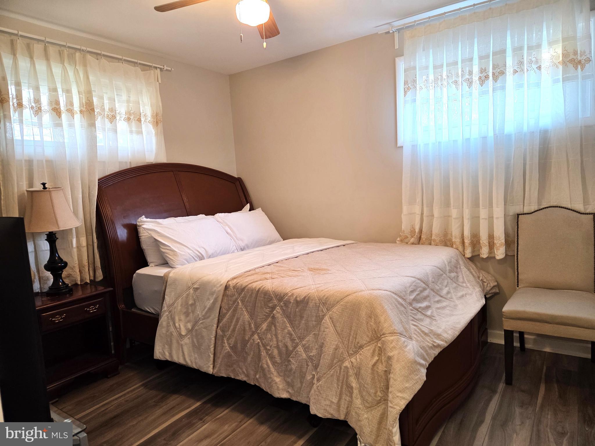 7613 Wilhelm Avenue Rosedale, MD 21237 - Photo 14 of 96 a bed sitting in a bedroom next to a window