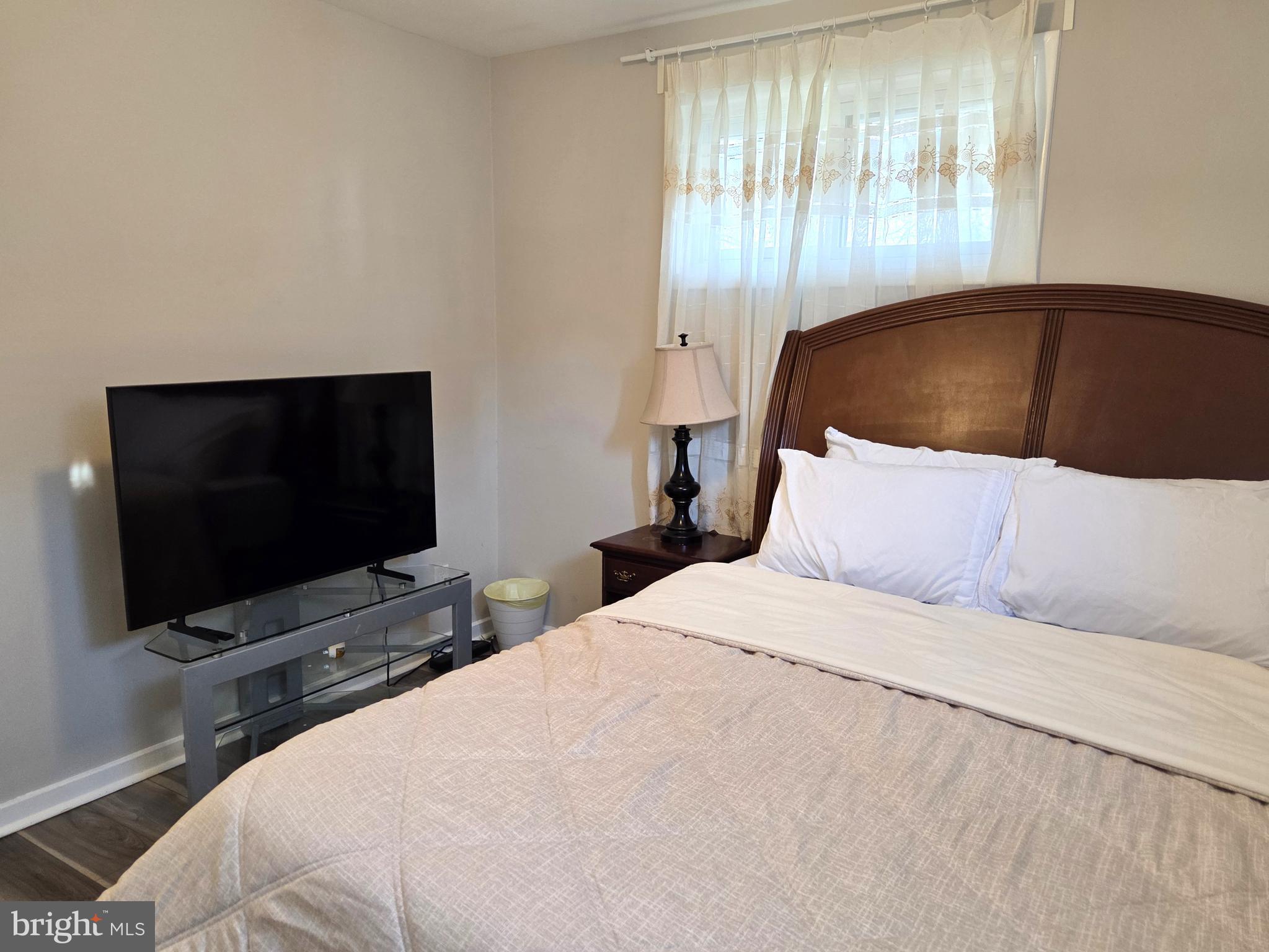 7613 Wilhelm Avenue Rosedale, MD 21237 - Photo 15 of 96 a bedroom with a bed and a flat screen tv
