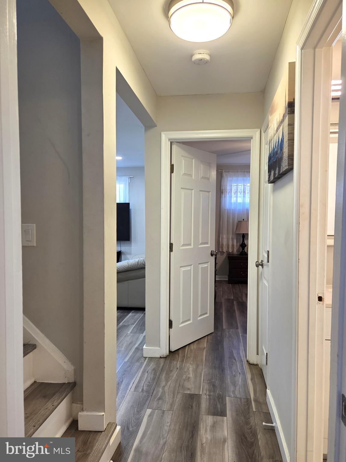 7613 Wilhelm Avenue Rosedale, MD 21237 - Photo 18 of 96 a view of a hallway with wooden floor
