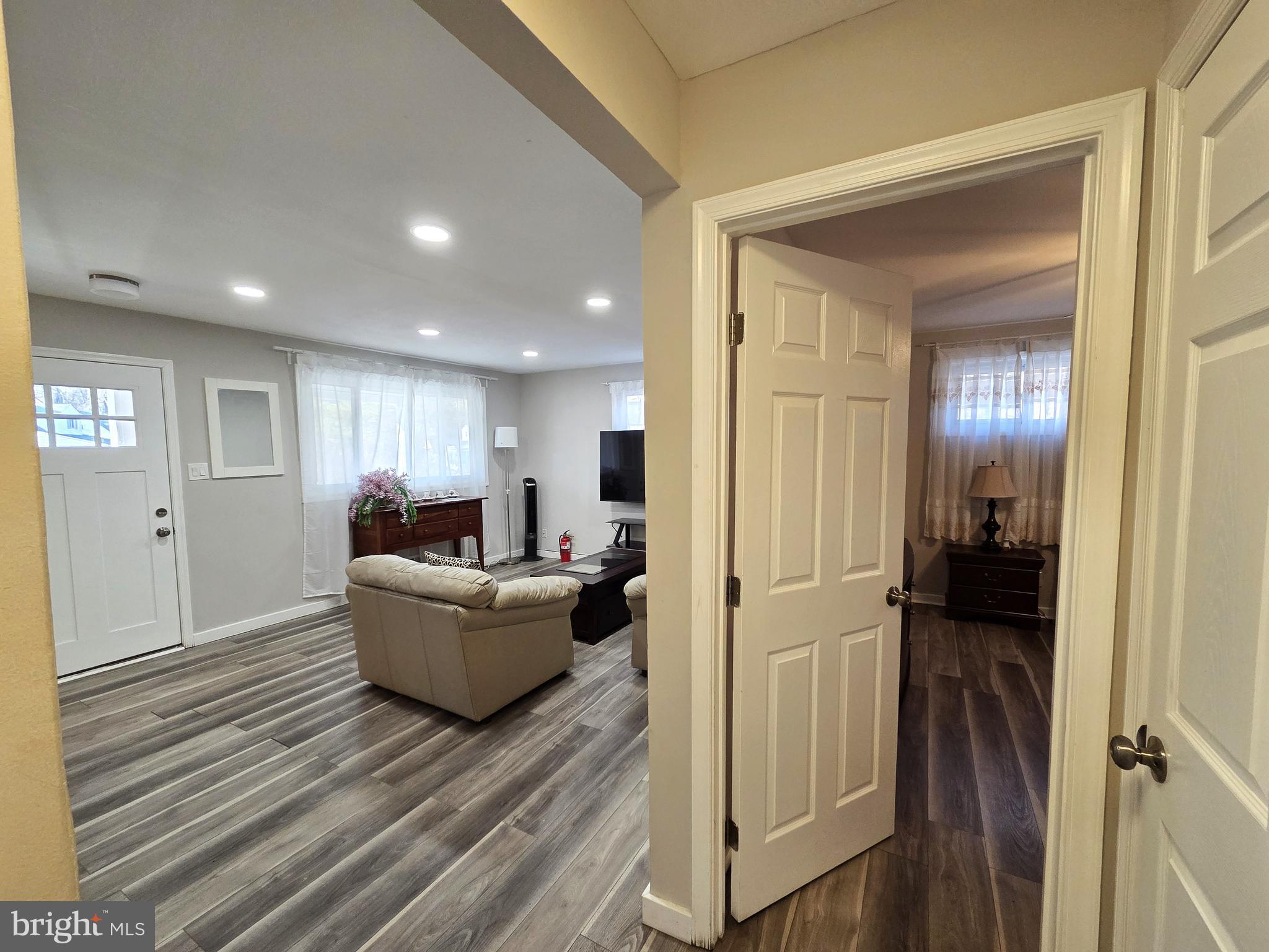 7613 Wilhelm Avenue Rosedale, MD 21237 - Photo 20 of 96 a living room with furniture and a wooden floor