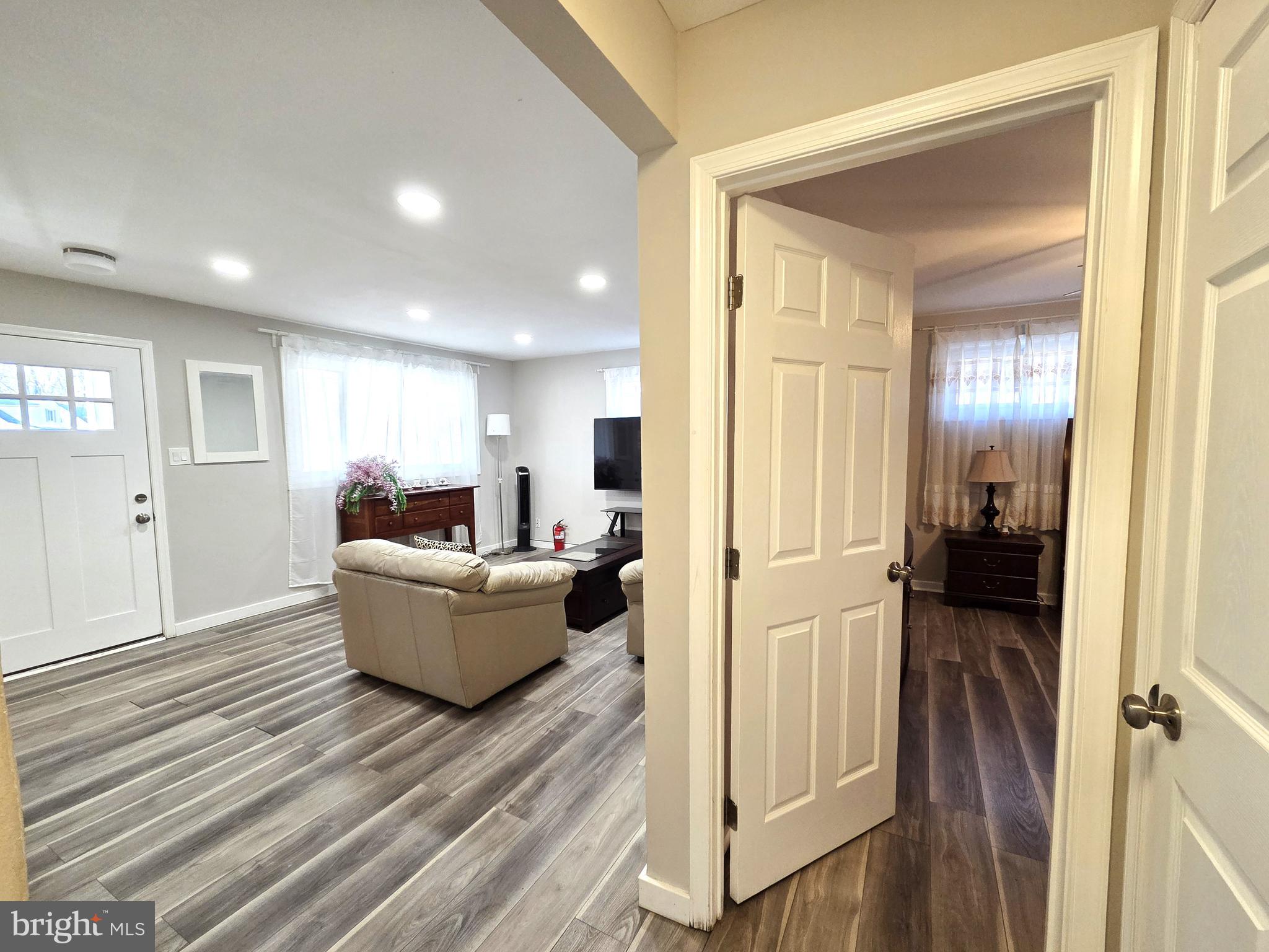 7613 Wilhelm Avenue Rosedale, MD 21237 - Photo 21 of 96 a living room with furniture and a wooden floor