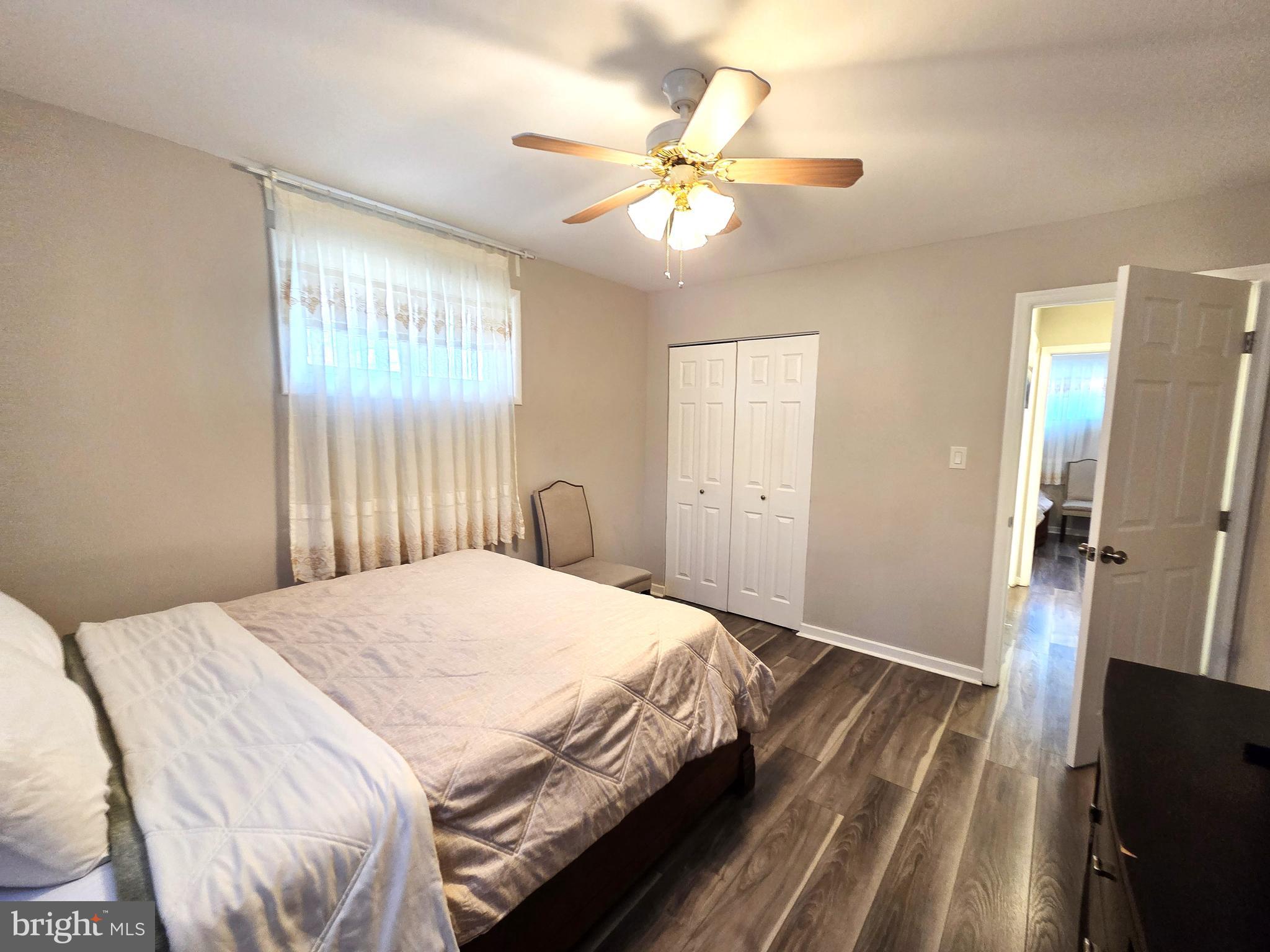 7613 Wilhelm Avenue Rosedale, MD 21237 - Photo 28 of 96 a bedroom with a bed and a chandelier