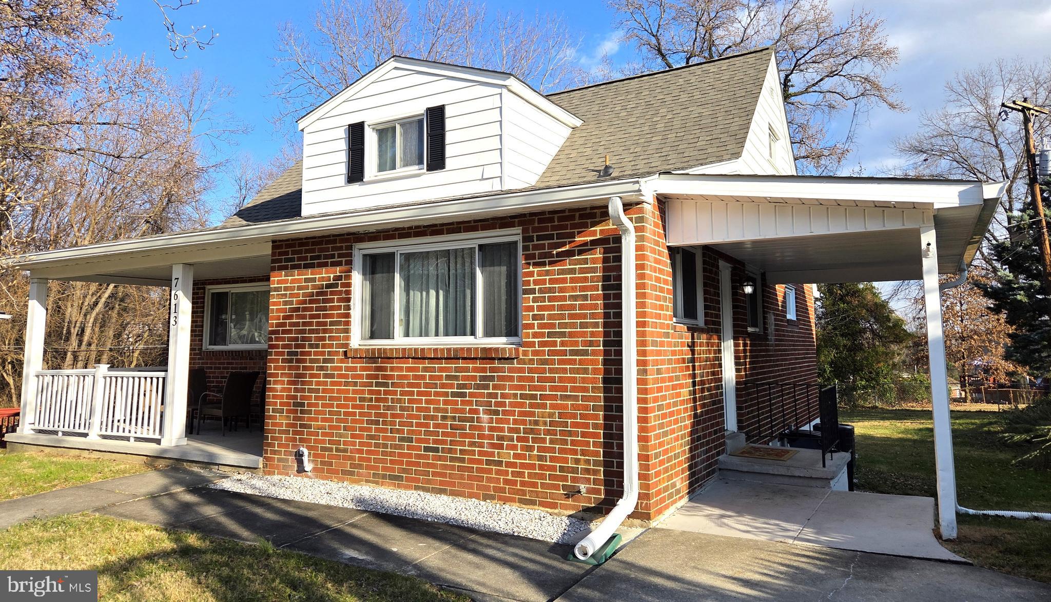 7613 Wilhelm Avenue Rosedale, MD 21237 - Photo 3 of 96 a view of a white house with a large windows