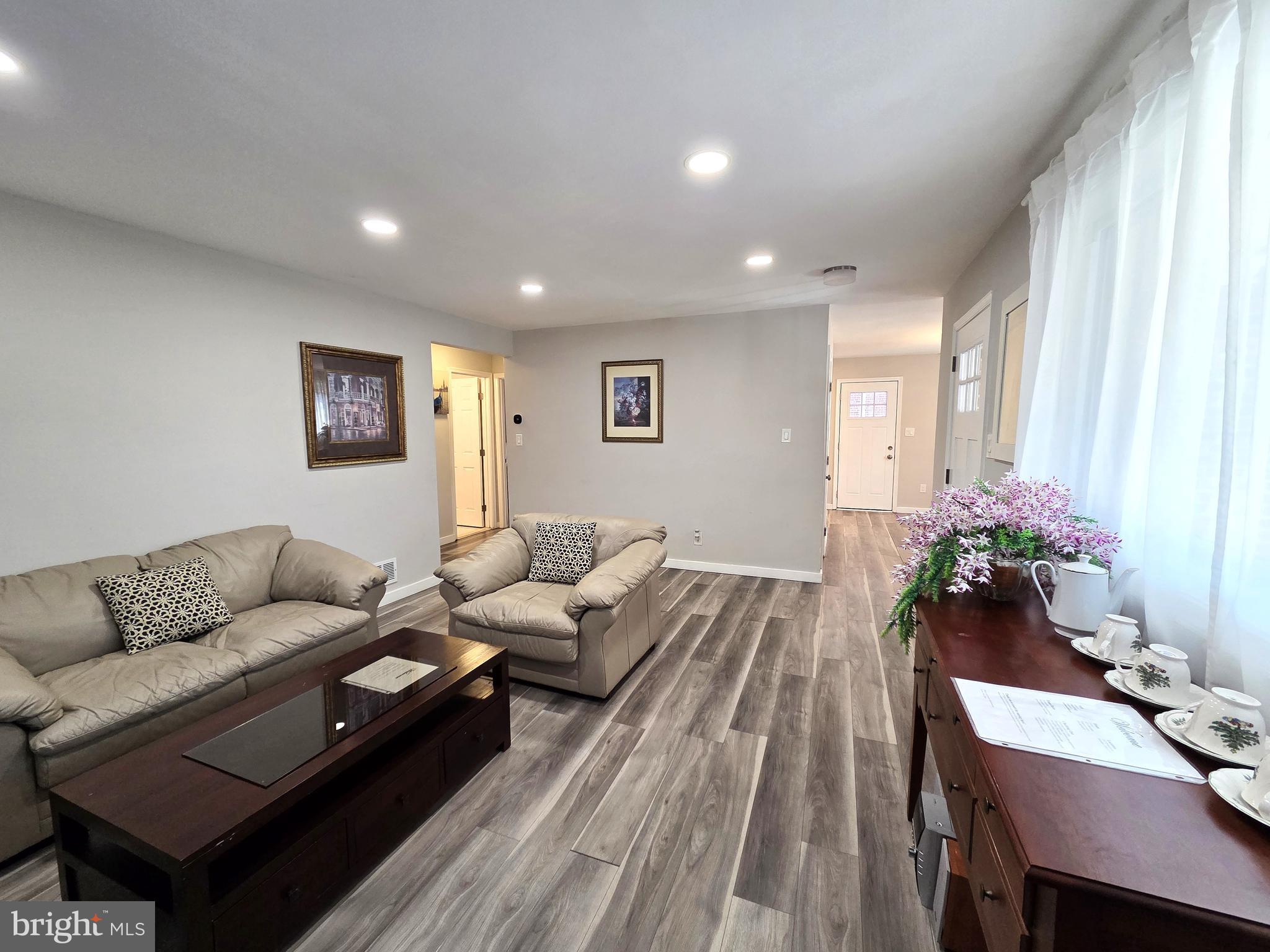 7613 Wilhelm Avenue Rosedale, MD 21237 - Photo 36 of 96 a living room with furniture and flowers