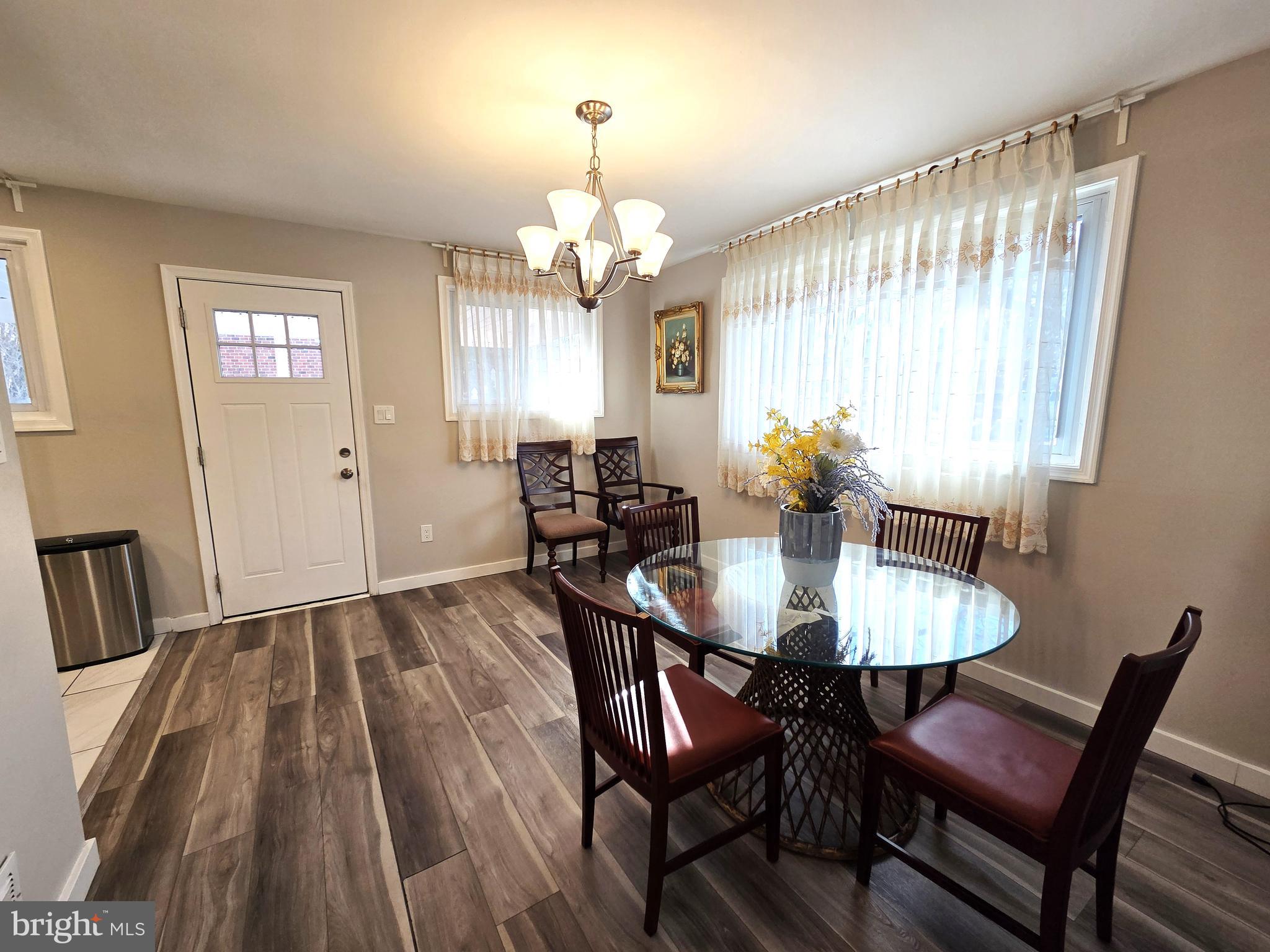 7613 Wilhelm Avenue Rosedale, MD 21237 - Photo 45 of 96 a view of a a dining room with furniture window and wooden floor