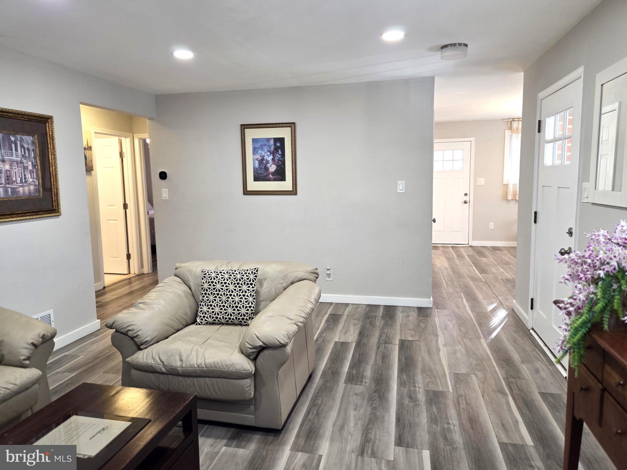 7613 Wilhelm Avenue Rosedale, MD 21237 - Photo 60 of 96 a living room with furniture and flowers