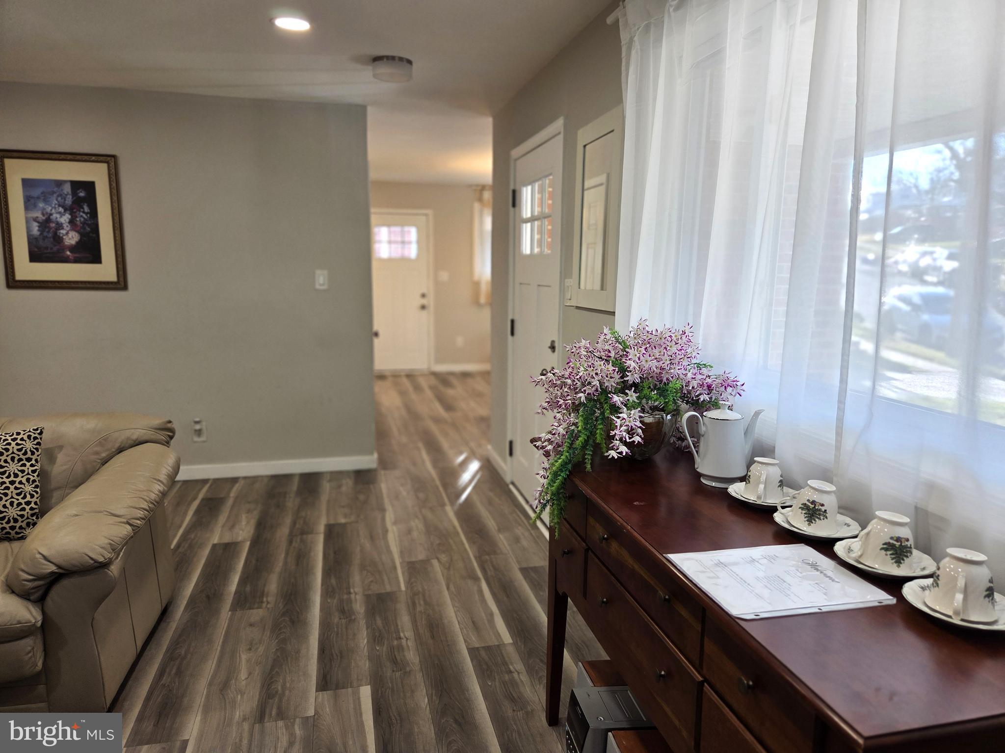 7613 Wilhelm Avenue Rosedale, MD 21237 - Photo 62 of 96 a view of a room with furniture and wooden floor