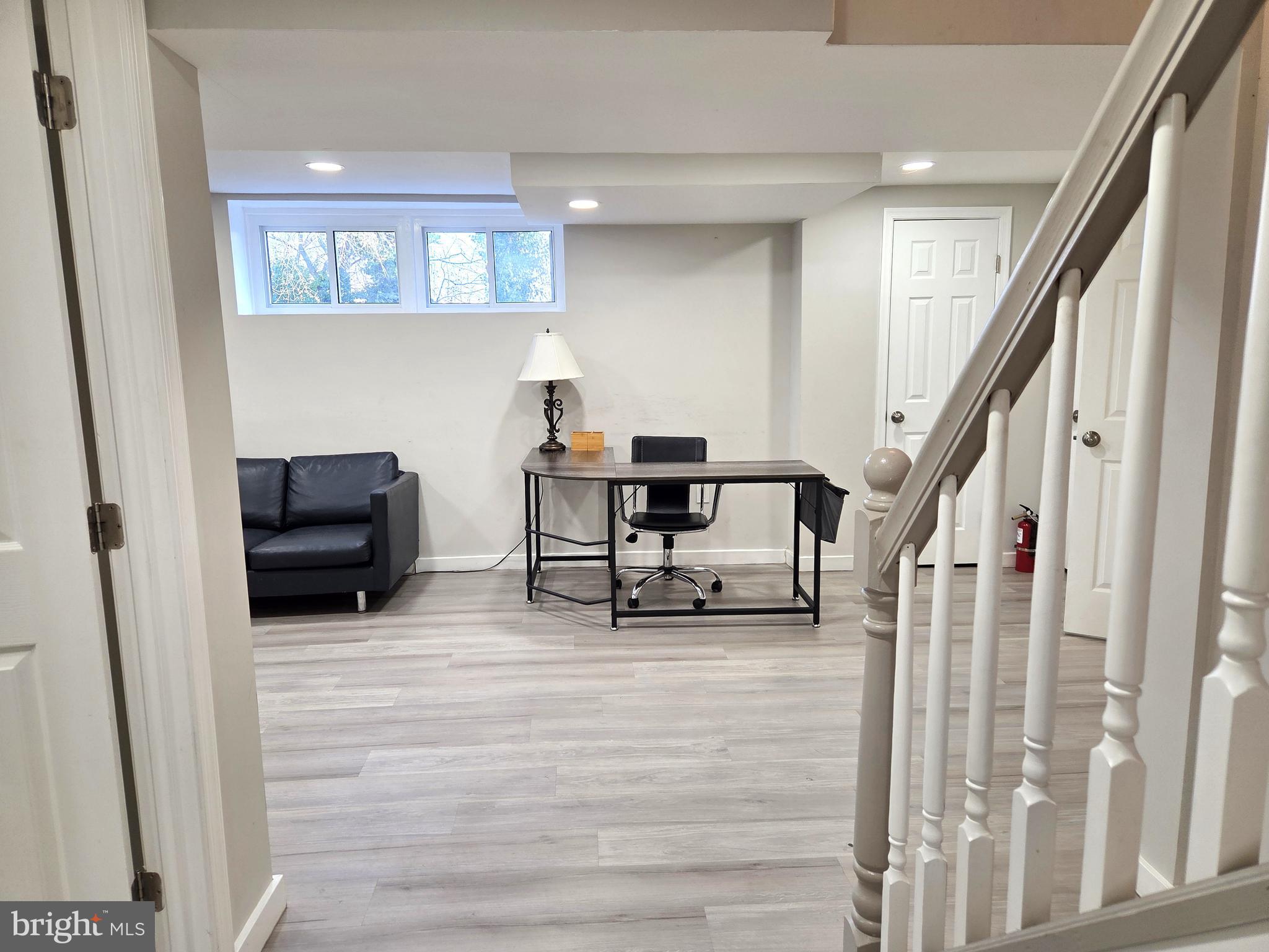 7613 Wilhelm Avenue Rosedale, MD 21237 - Photo 80 of 96 a living room with furniture and a rug