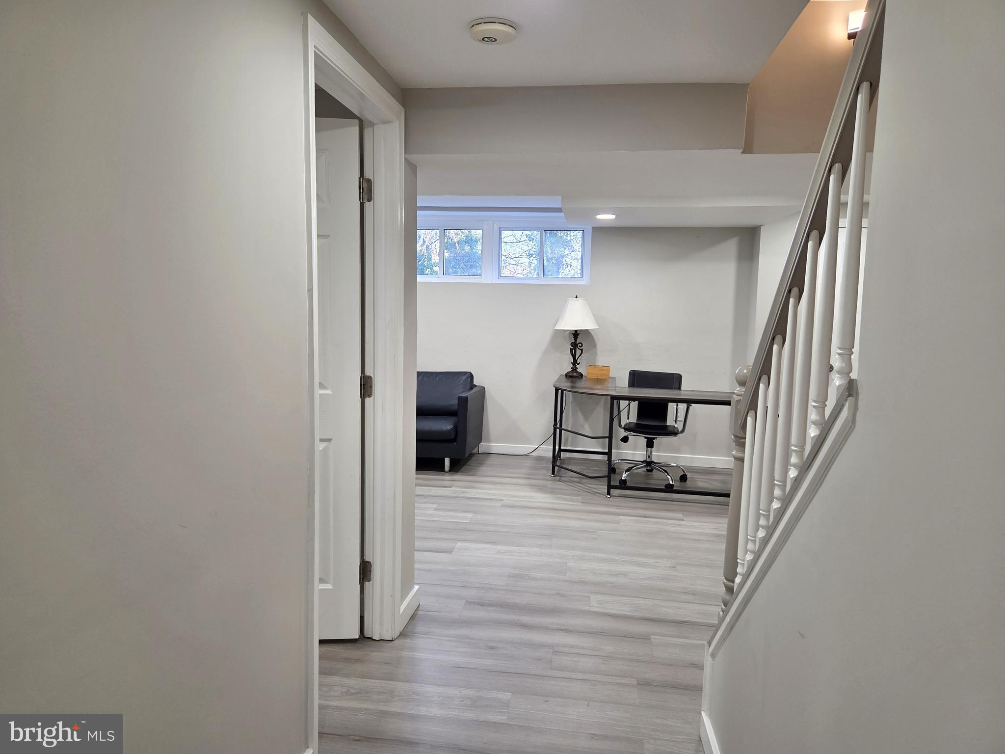 7613 Wilhelm Avenue Rosedale, MD 21237 - Photo 81 of 96 a view of a livingroom with a piano and wooden floor