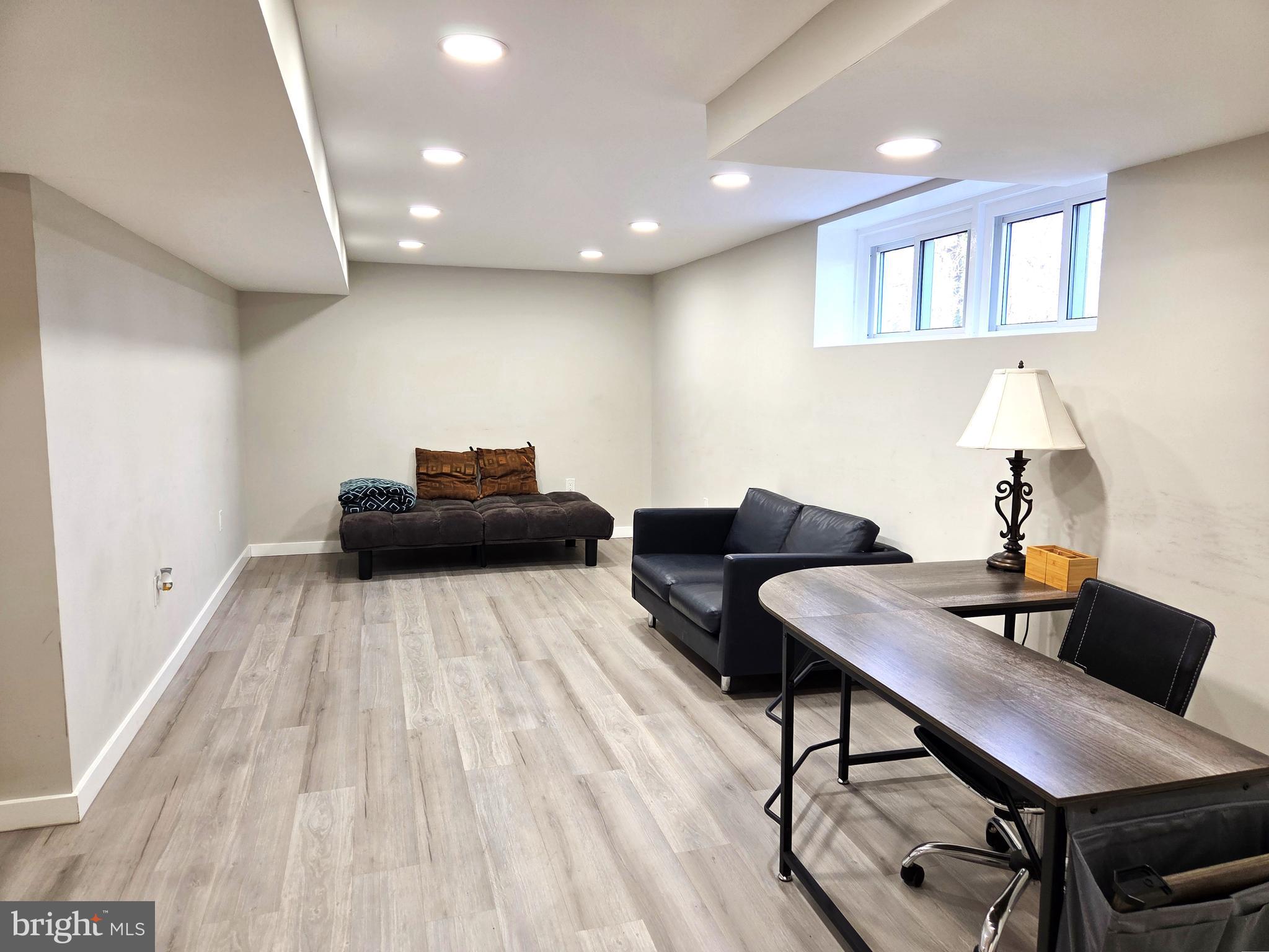 7613 Wilhelm Avenue Rosedale, MD 21237 - Photo 86 of 96 a living room with furniture and a wooden floor