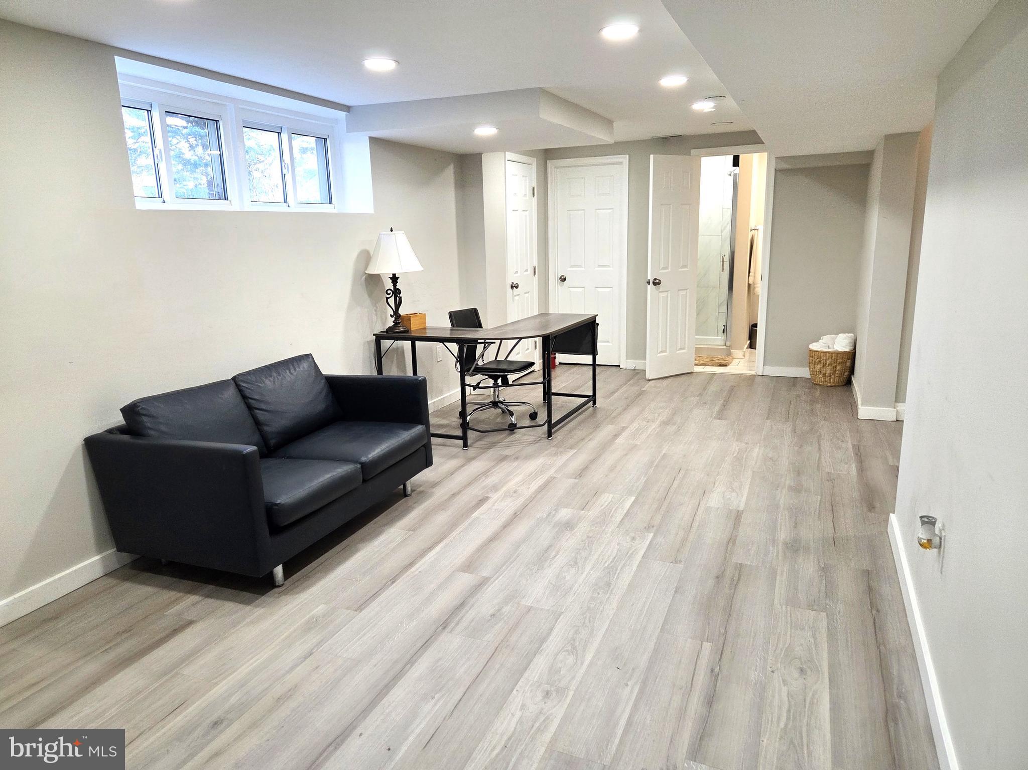 7613 Wilhelm Avenue Rosedale, MD 21237 - Photo 90 of 96 a living room with furniture and a wooden floor
