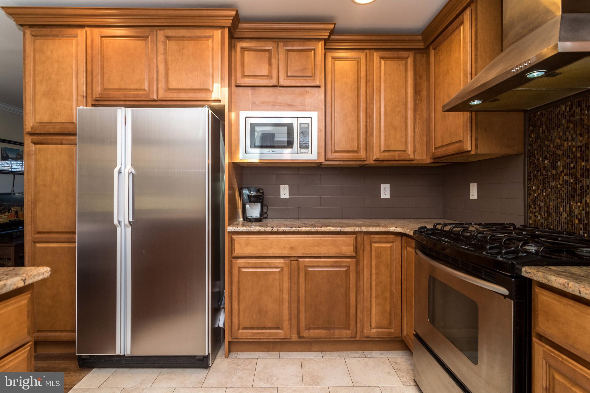 1306 Sylvan Road Perkasie, PA 18944 - Photo 12 of 47 a kitchen with stainless steel appliances granite countertop a refrigerator and a sink
