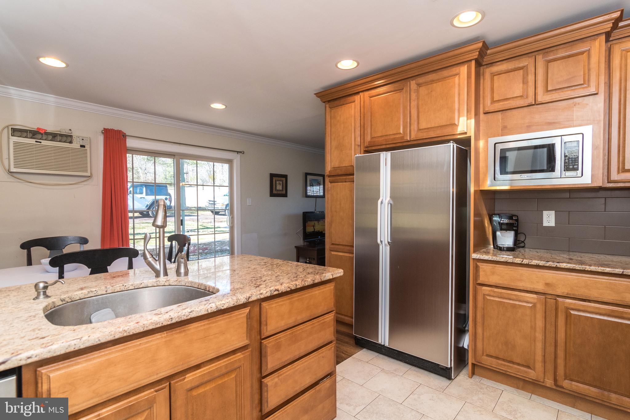 1306 Sylvan Road Perkasie, PA 18944 - Photo 14 of 47 a kitchen with stainless steel appliances granite countertop a granite counter tops and a window