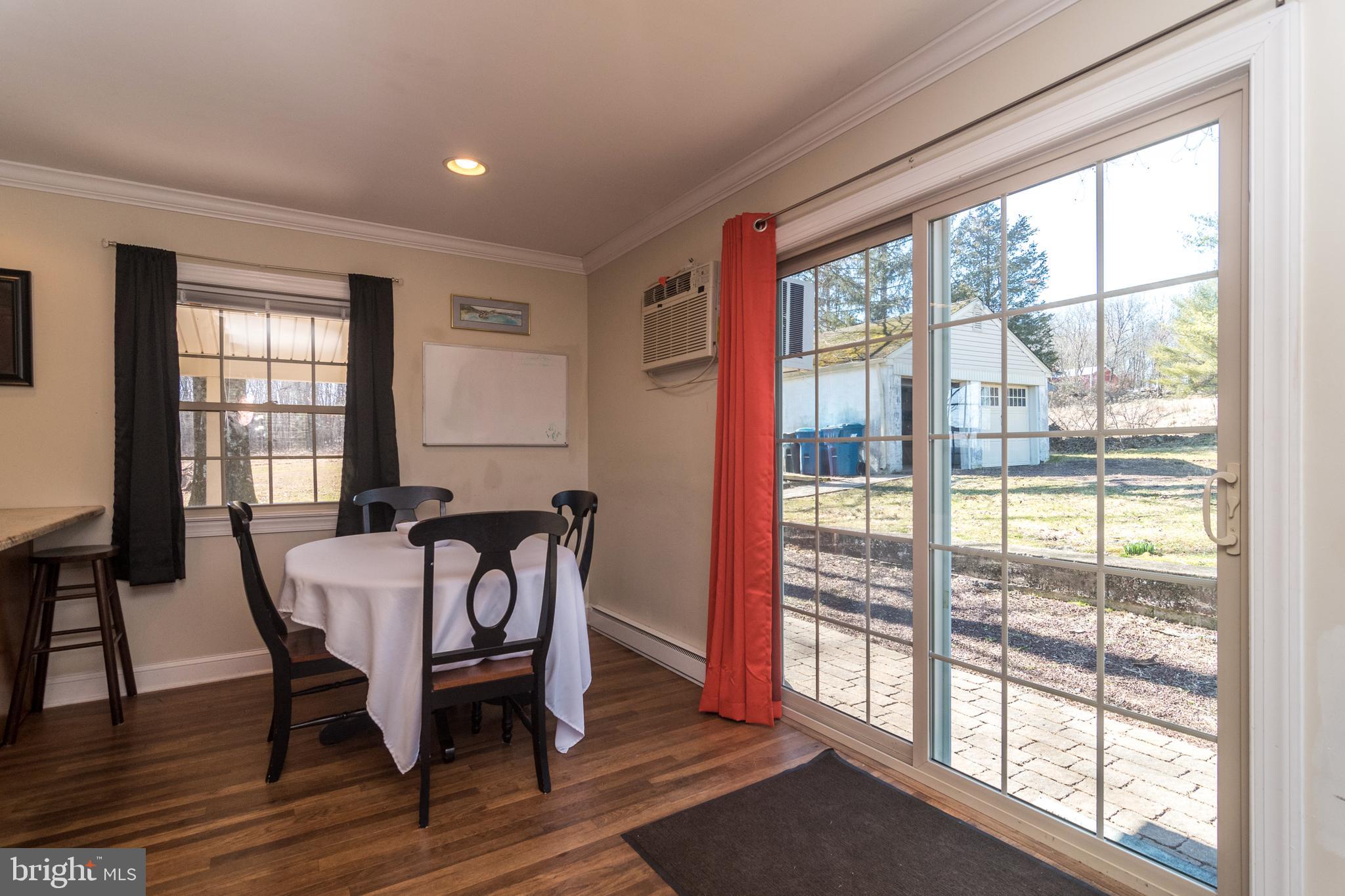 1306 Sylvan Road Perkasie, PA 18944 - Photo 20 of 47 a view of a dining room with furniture window and wooden floor