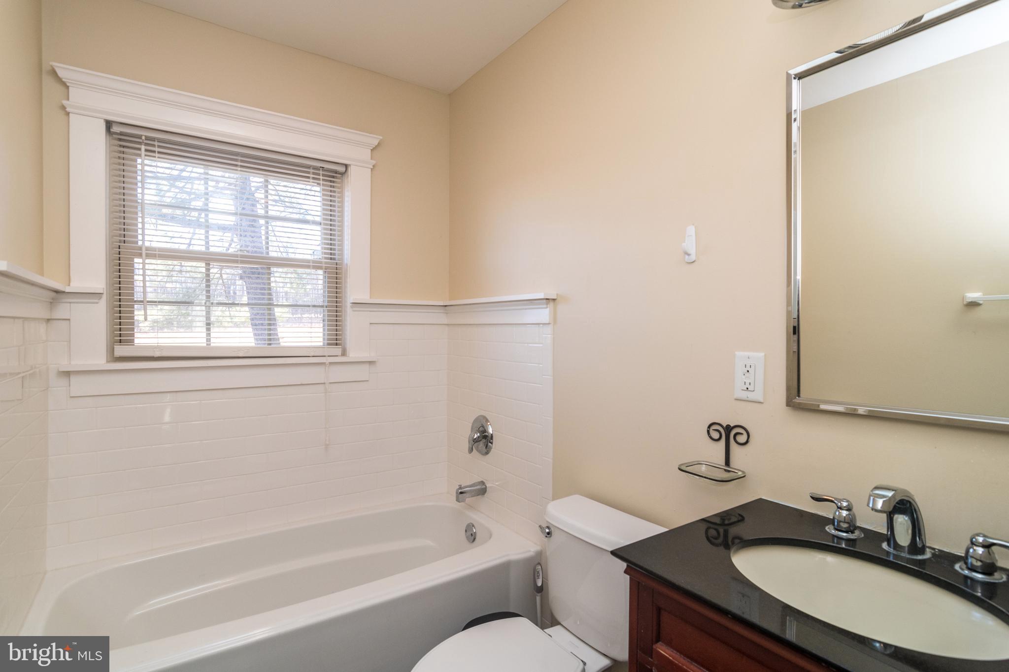 1306 Sylvan Road Perkasie, PA 18944 - Photo 24 of 47 a bathroom with a granite countertop sink toilet and shower