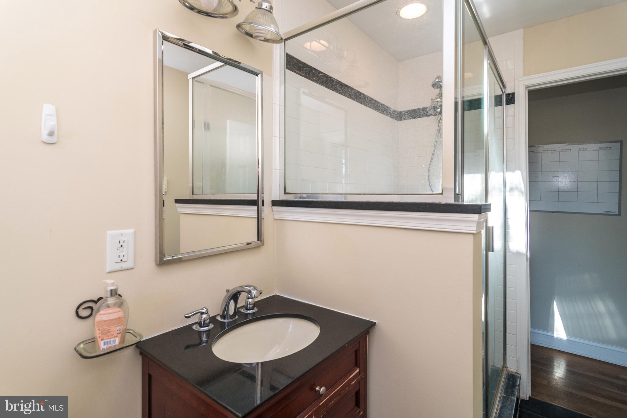 1306 Sylvan Road Perkasie, PA 18944 - Photo 25 of 47 a bathroom with a sink and mirror