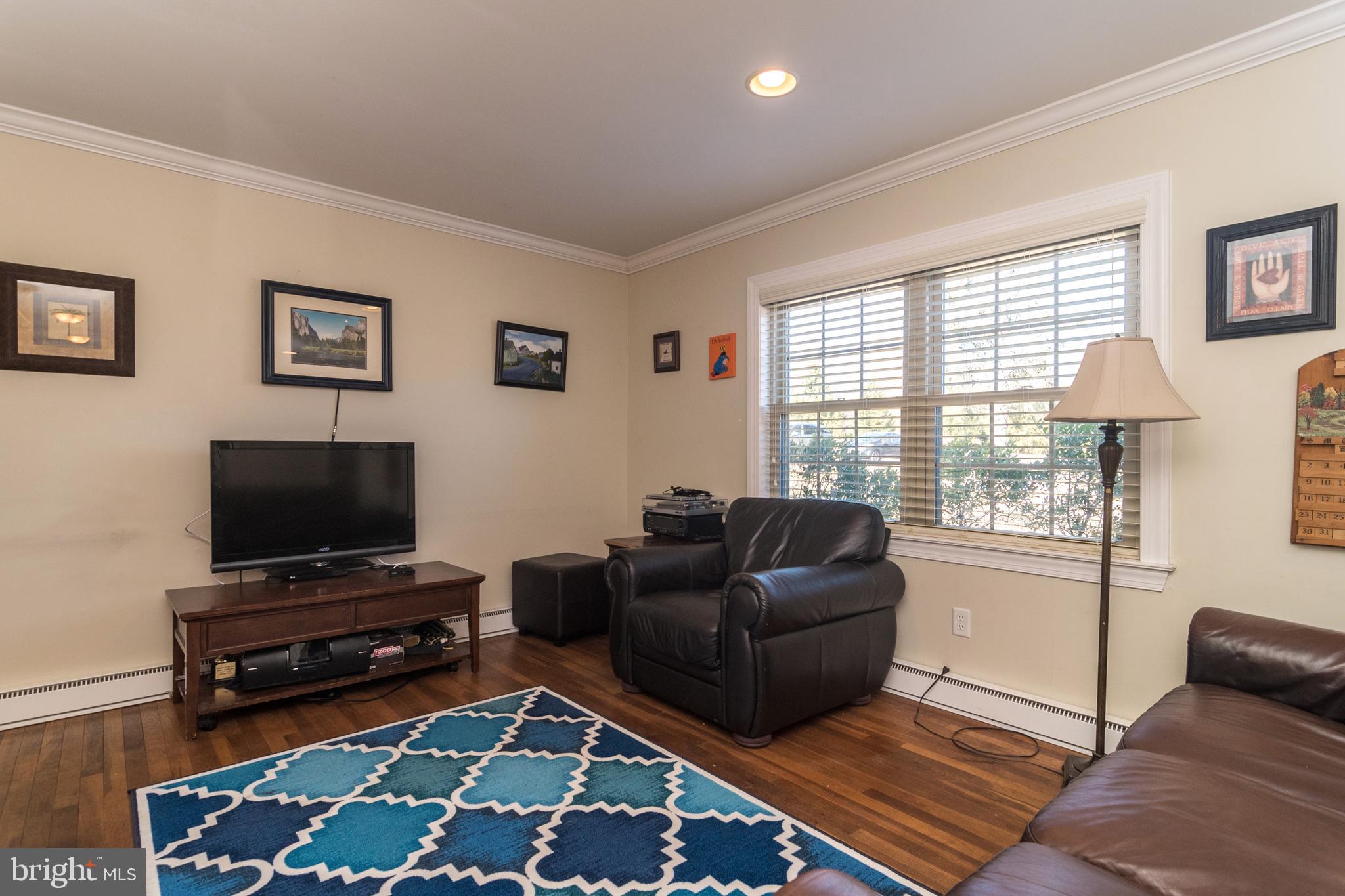 1306 Sylvan Road Perkasie, PA 18944 - Photo 9 of 47 a living room with furniture and a flat screen tv
