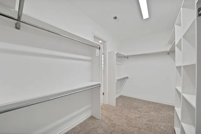 a view of an empty walk in closet