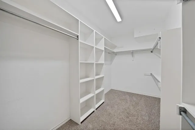 a view of an empty walk in closet