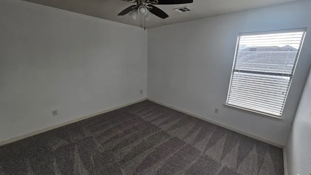 a view of a room that has a window in it